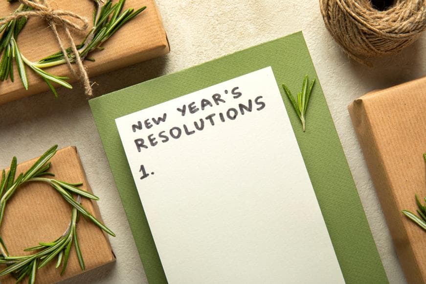 New year's resolutions written on piece of paper with empty #1 for the list