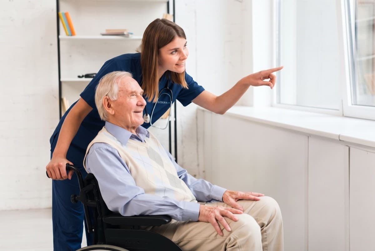 picture of woman providing senior home care and looking out window