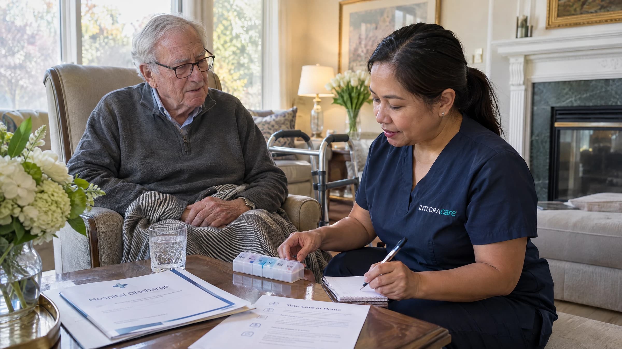 A caregiver helps a senior recently discharged from hospital with his medications in a bright, comfortable living room at home.