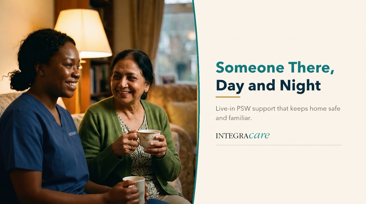 Caregiver in navy scrubs and a senior woman in a green cardigan sharing a hot drink together on a living room sofa