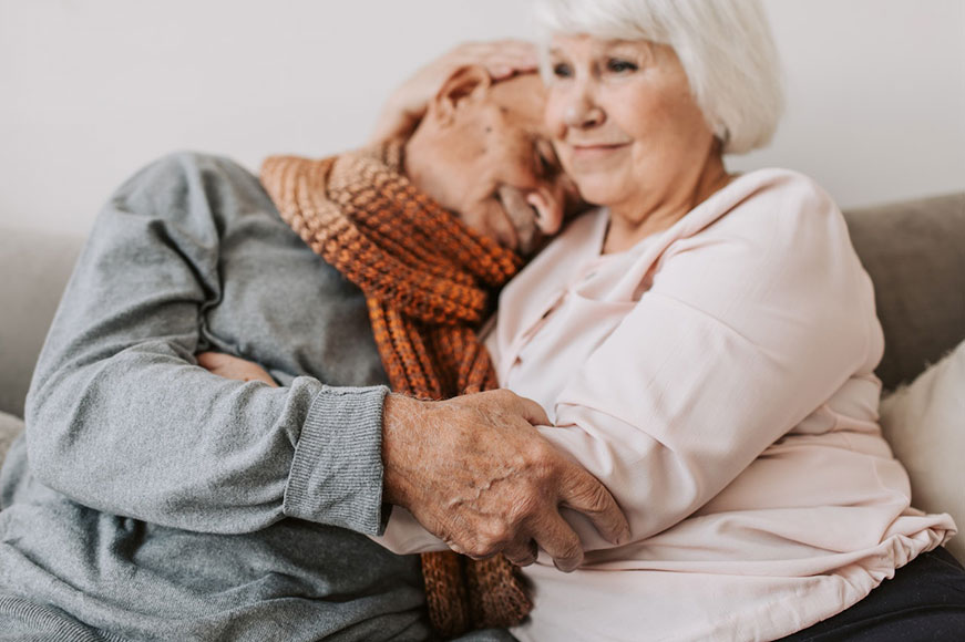 Image of seniors hugging
