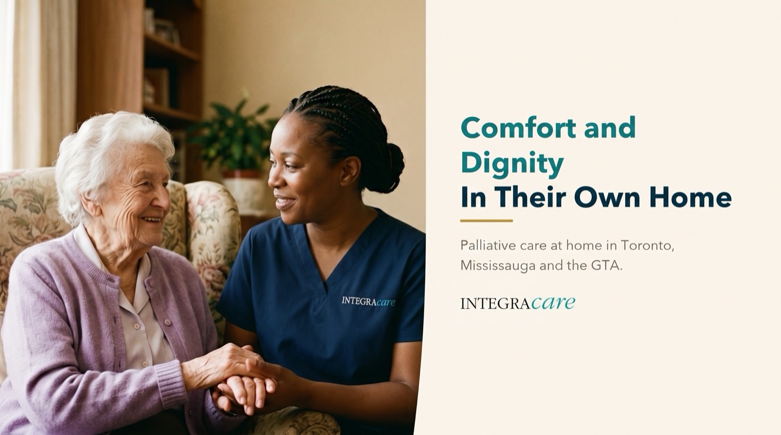 Caregiver gently holding hands with a smiling senior woman seated in a floral armchair at home