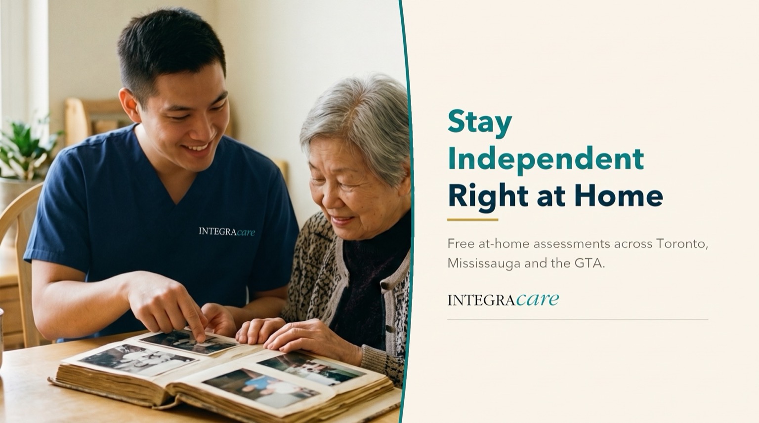 Young man and his grandmother smiling as they look through a family photo album at a kitchen table